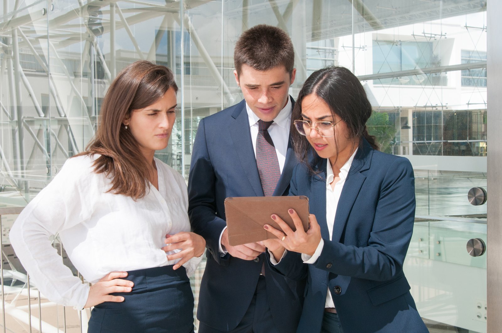 Professionals collaborating over corporate documents